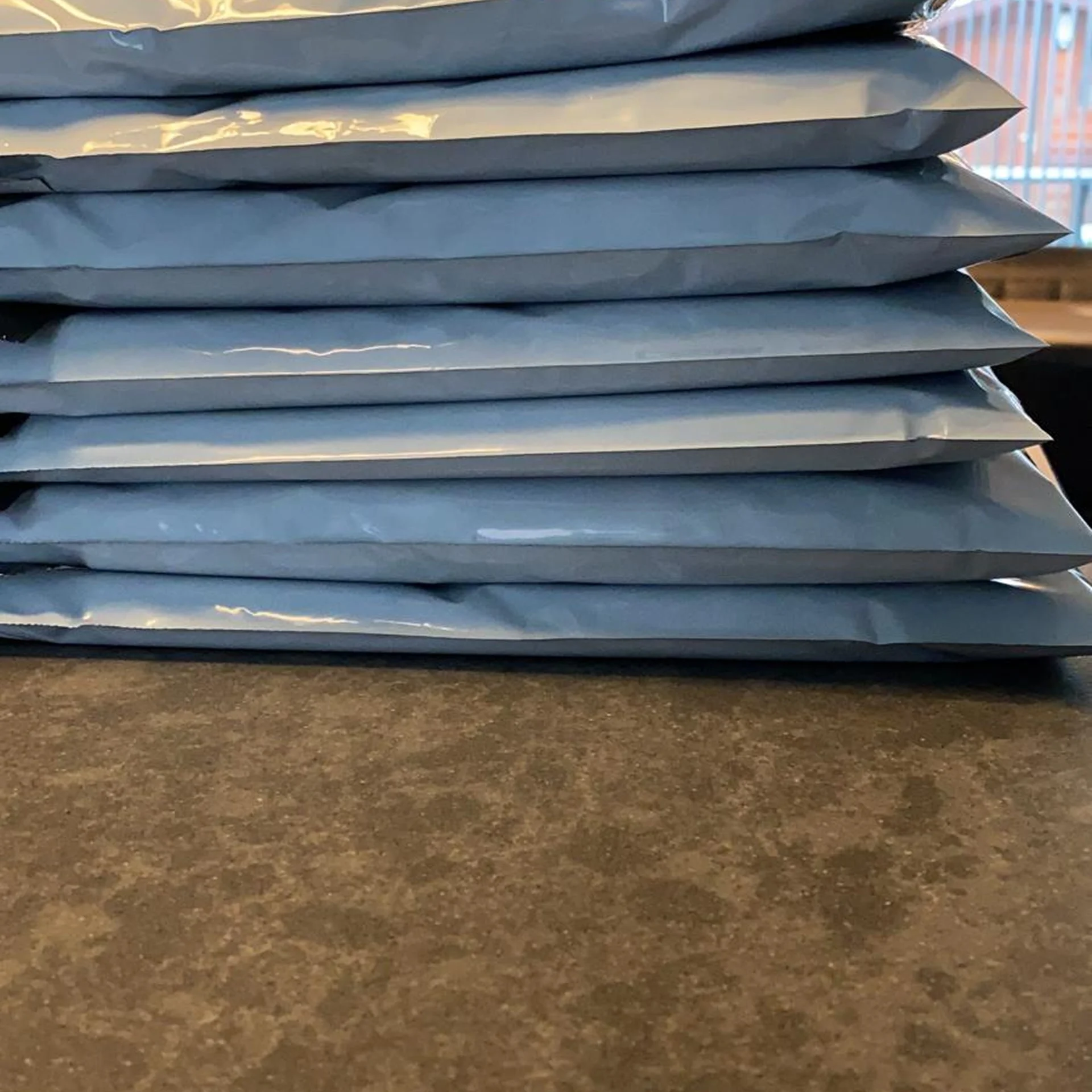 Stack of Oldskull shipping mailers ready for fulfilment