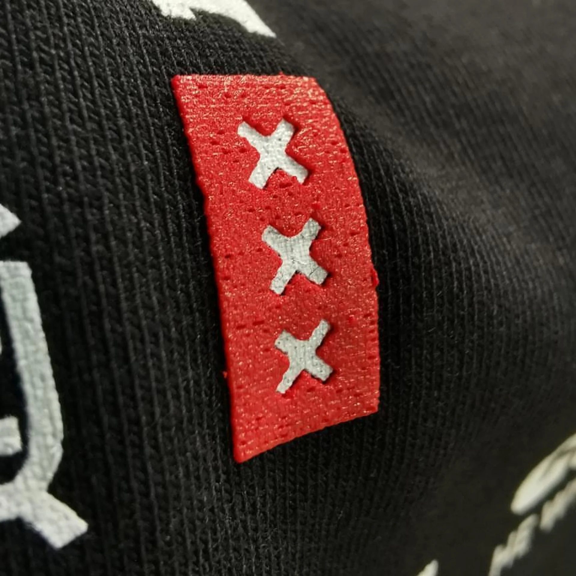 Amsterdam crosses woven label on an Oldskull cap