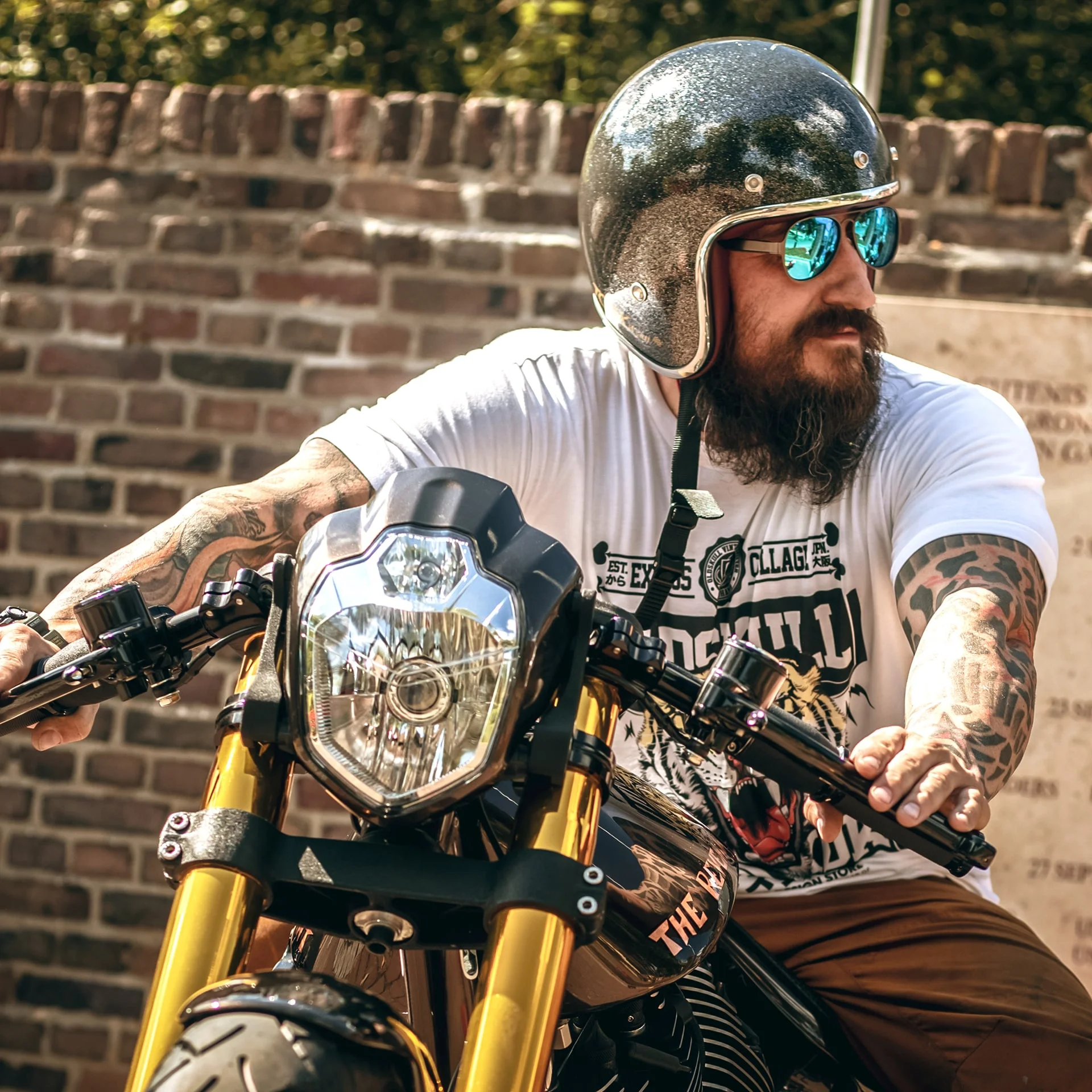 Rider wearing Oldskull on a custom motorcycle